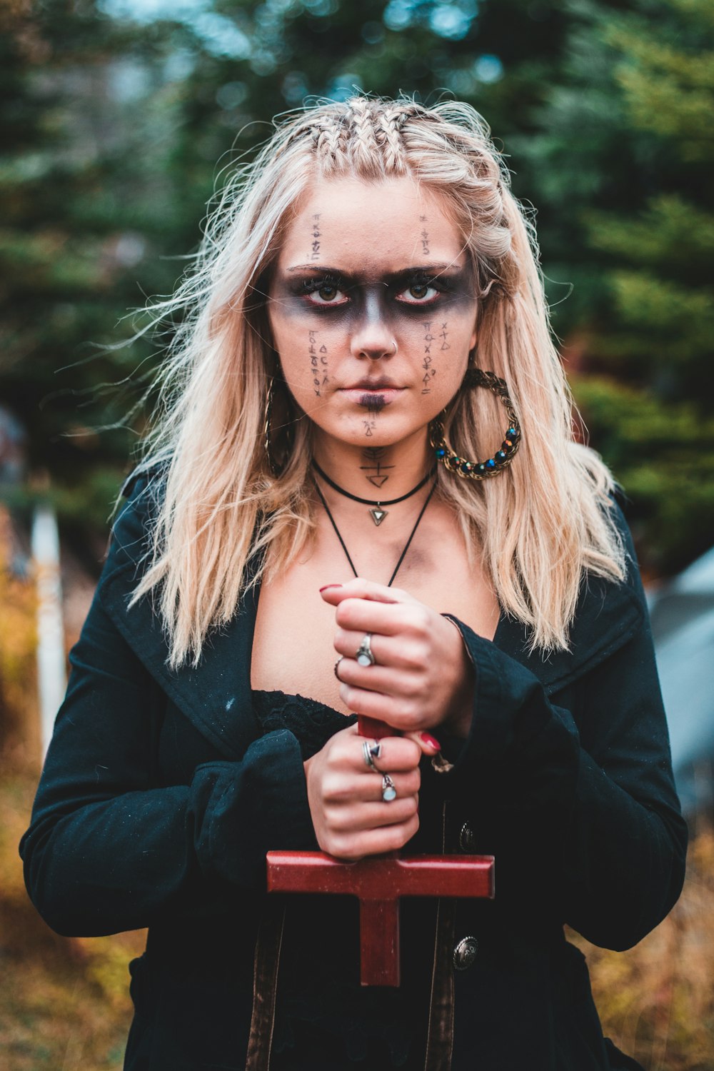 woman in black long sleeve shirt holding her hair