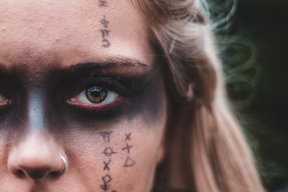 woman with black and red eye shadow