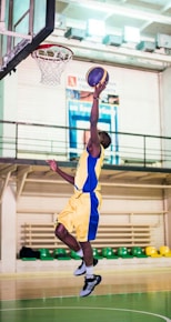 man in yellow jersey shirt and yellow shorts
