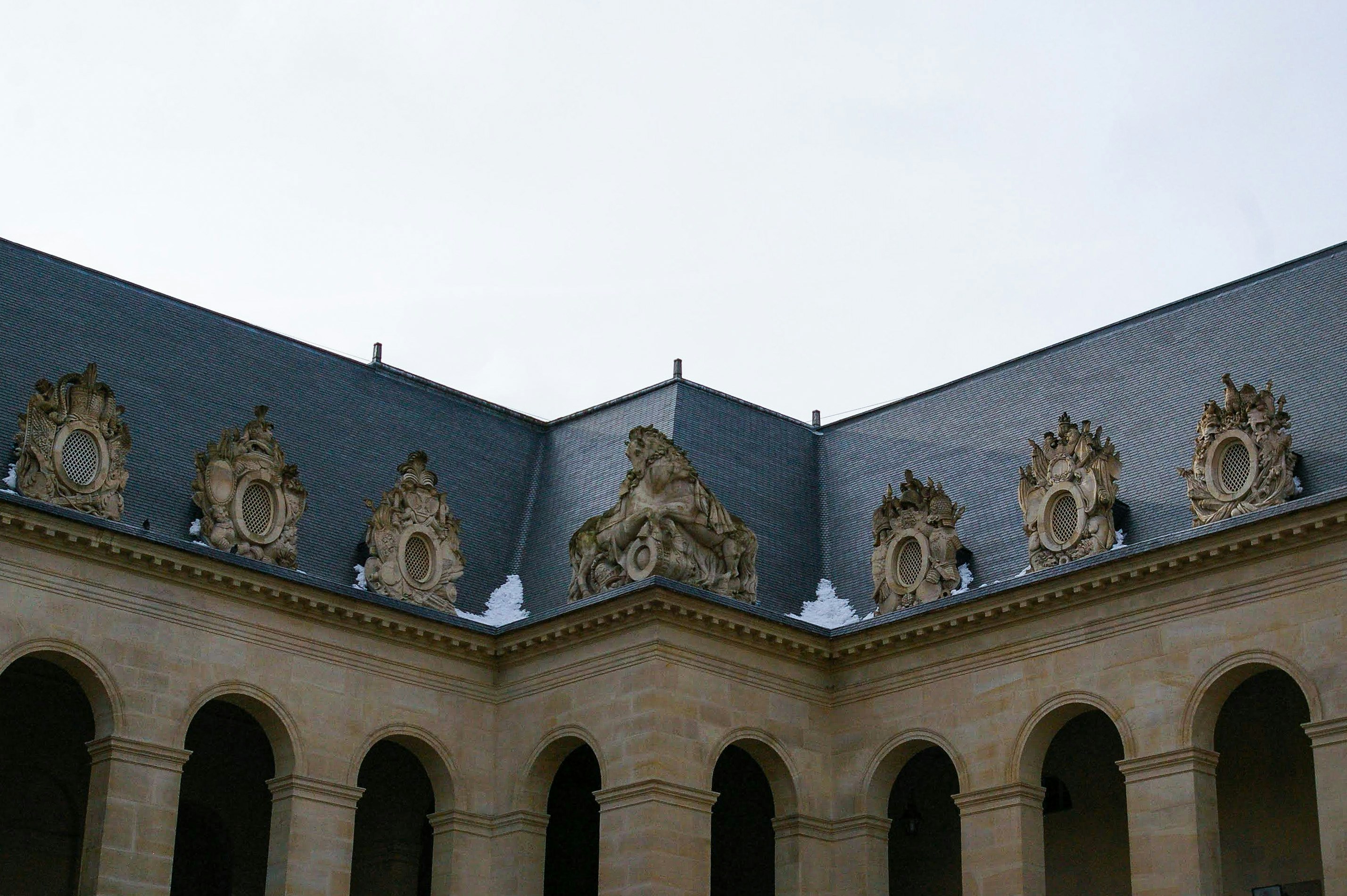 blue and white concrete building under white sky during daytime