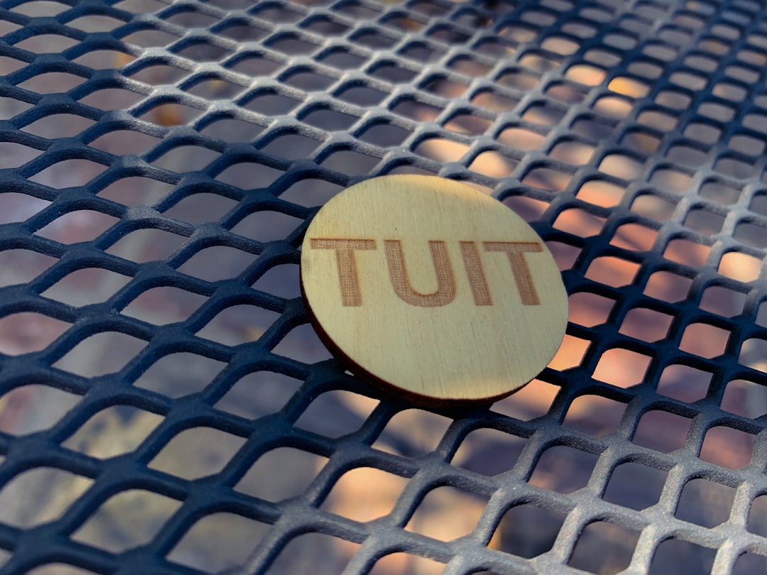 brown wooden round ornament on gray metal mesh table