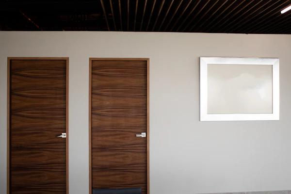 Interior Door Selection: brown wooden door beside white wall