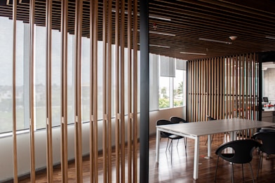 white and brown window blinds