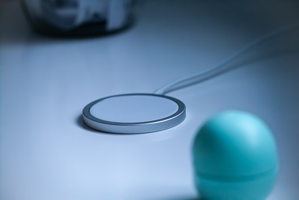 blue round ornament on white table