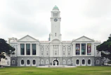 white concrete building with clock tower