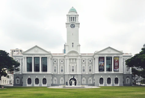 white concrete building with clock tower