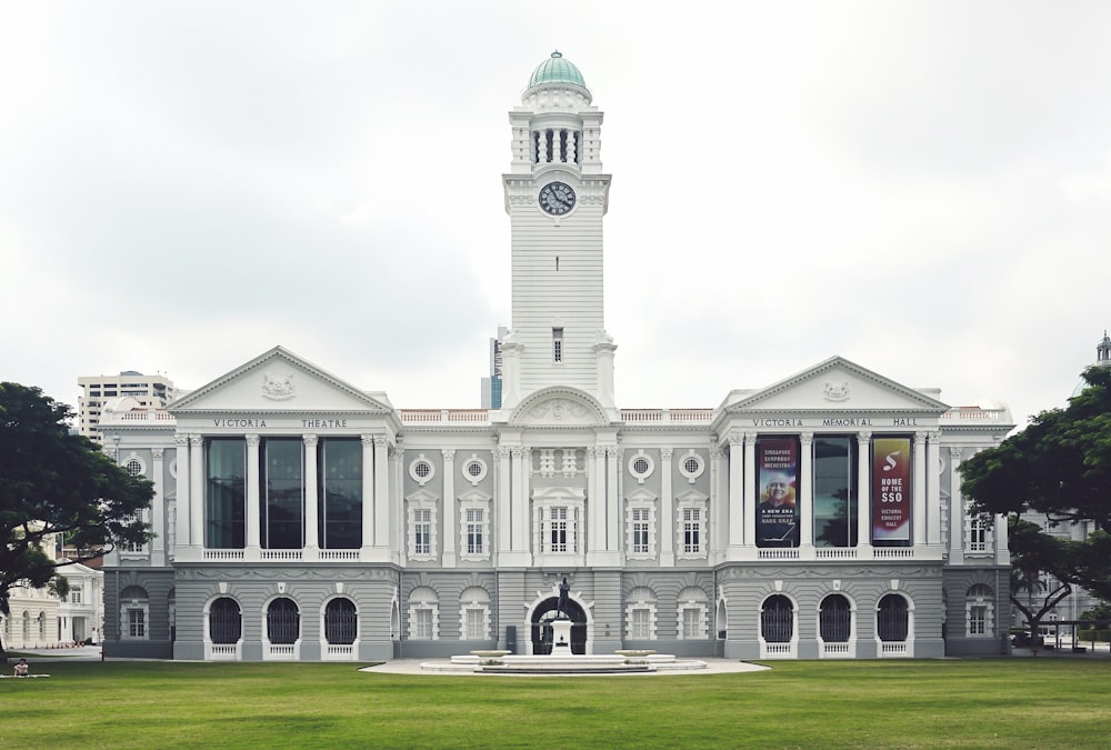 white concrete building with clock tower