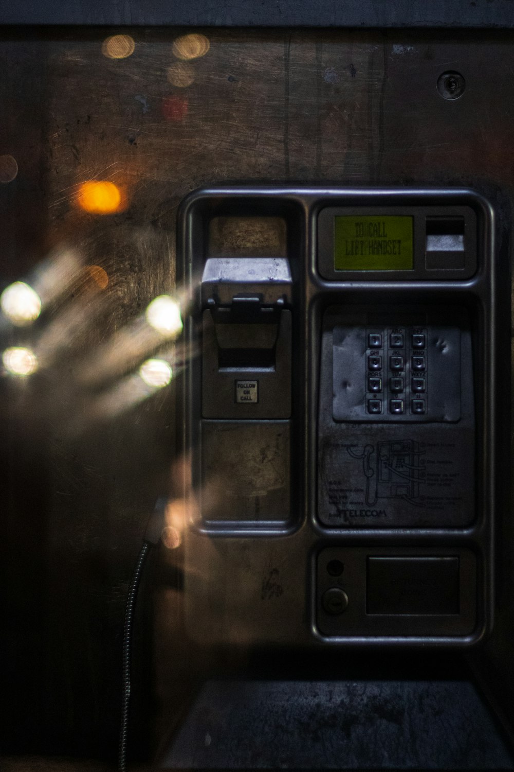 black and gray telephone booth