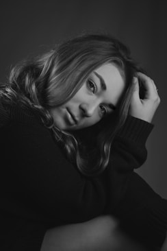 woman in black turtleneck sweater