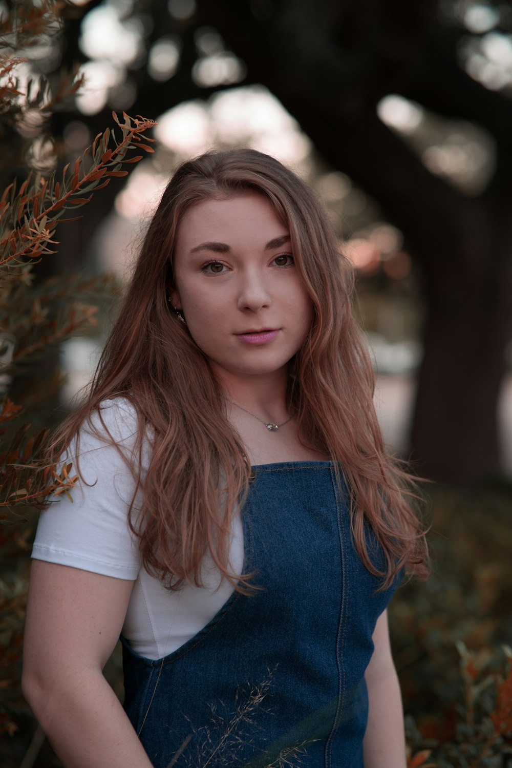 girl in white t-shirt and blue denim bottoms