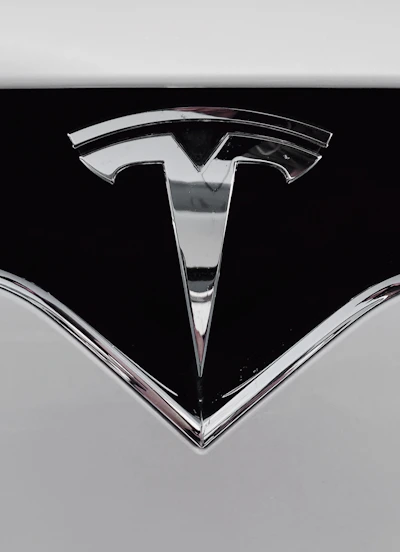 Close-up of a sleek TCN auto labeler showing its digital display and label output.