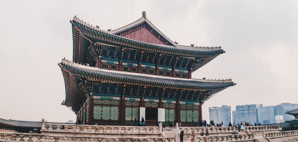 red and green temple under white sky during daytime