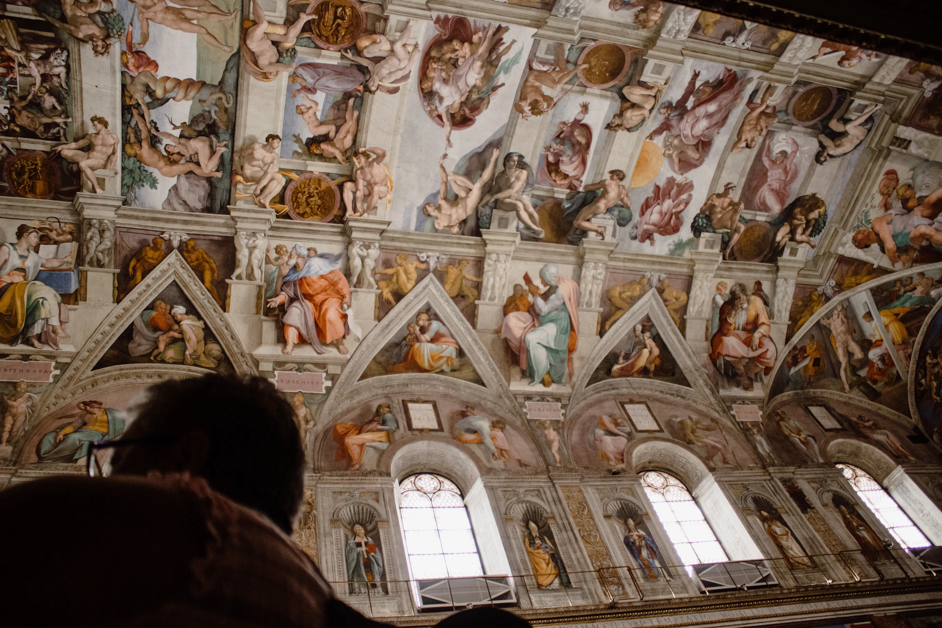 people inside white and brown building