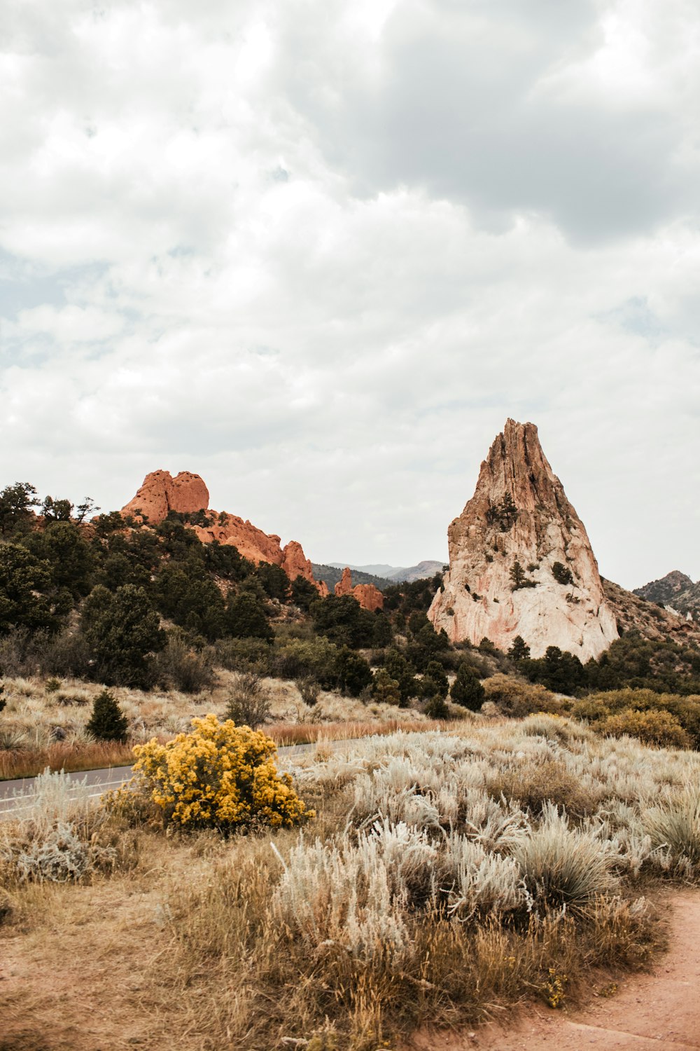 brown rocky mountain under white cloudy sky during daytime