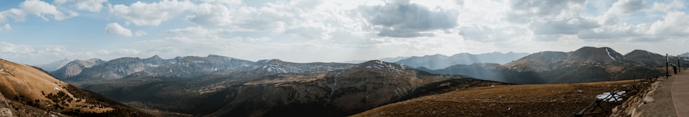 brown mountain under white clouds during daytime