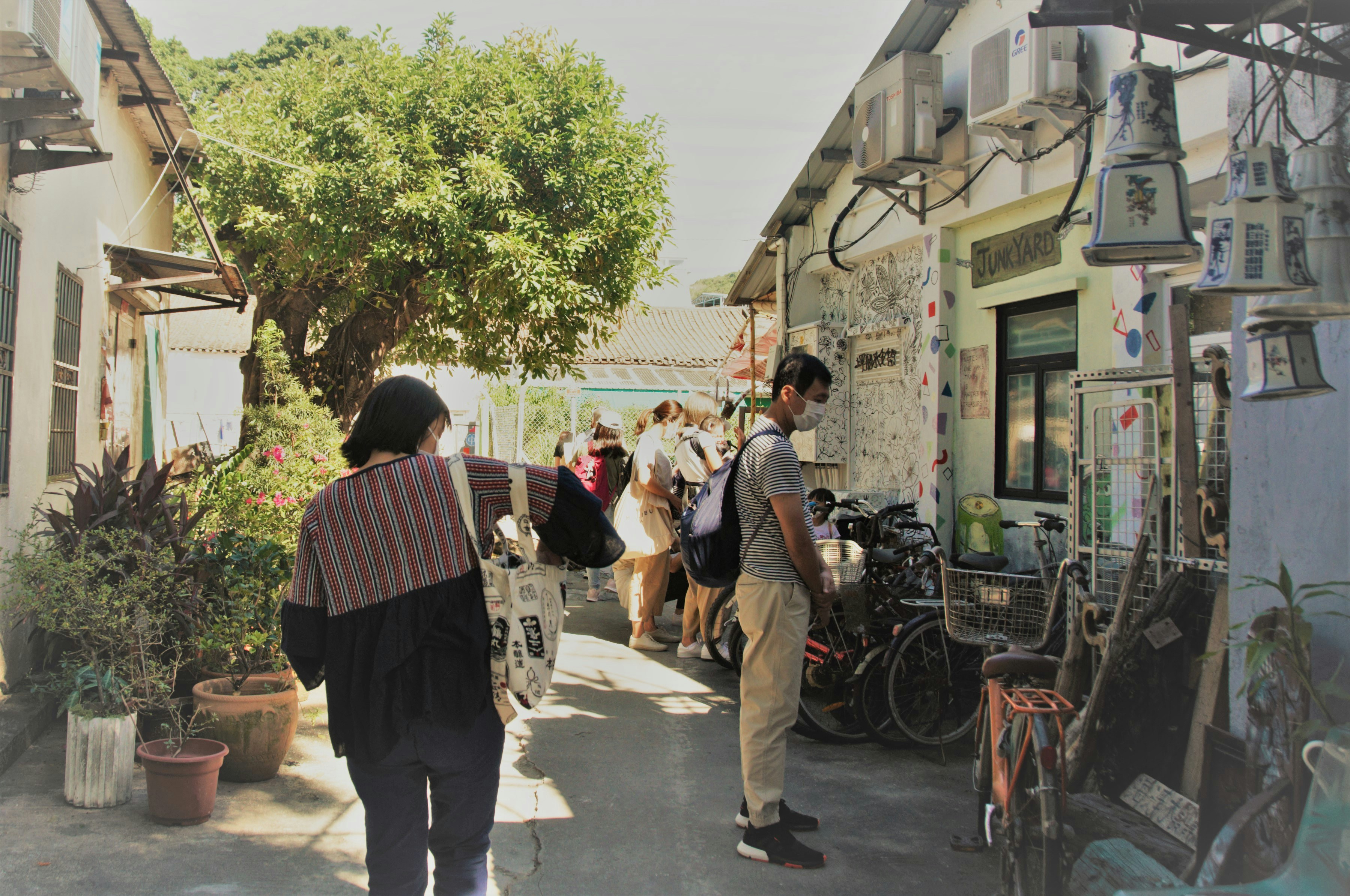 Visitors exploring the historic streets of Haga with cafes and shops