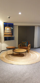 A textured woven rug anchoring a seating area with earthy tones and natural fibers.