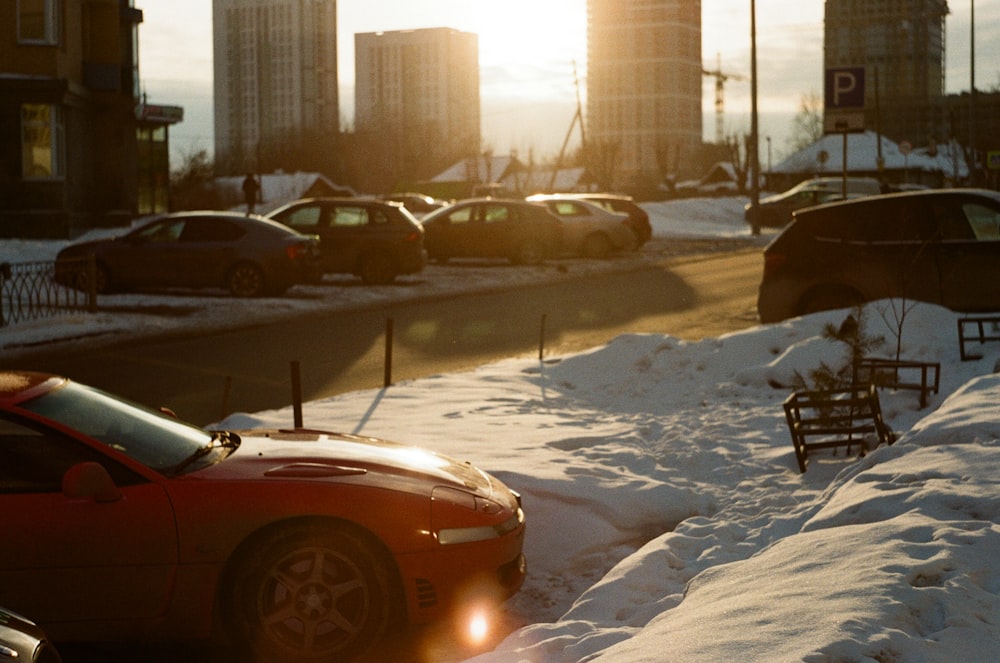 white car on snow covered road during daytime