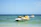 Group of friends preparing to set off on jet skis under bright clear skies