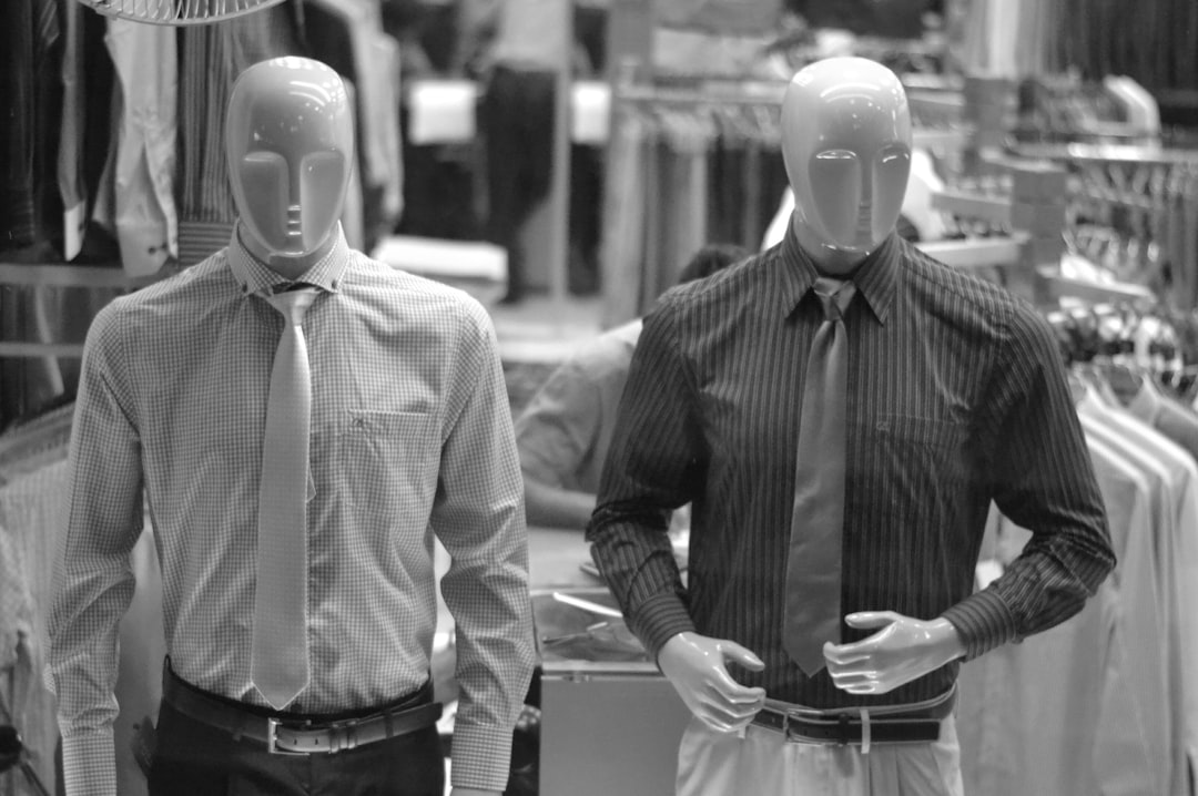 man in white dress shirt and black and white striped necktie