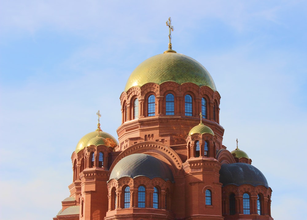 brown and blue dome building under blue sky during daytime