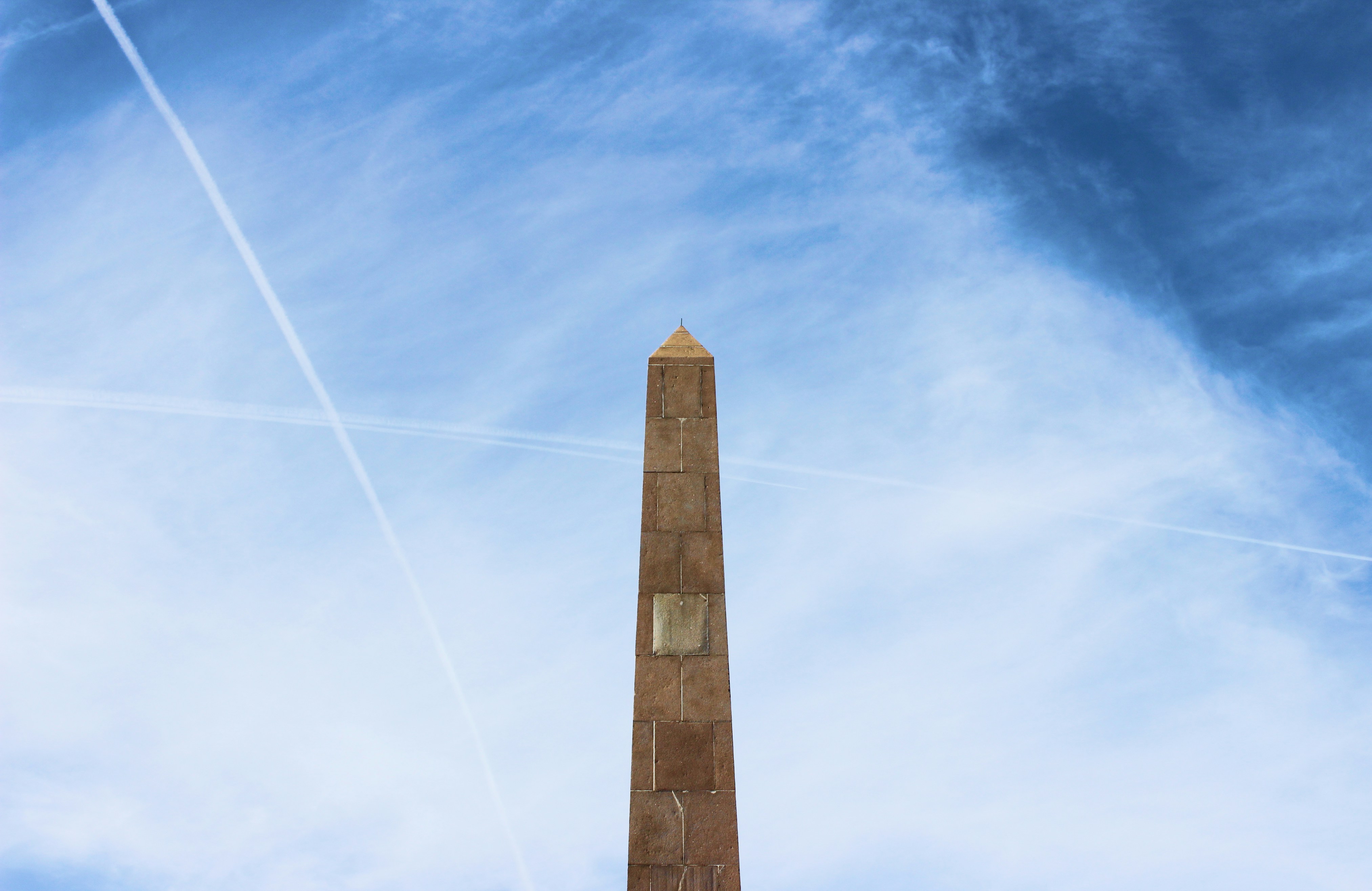 brown concrete tower under blue sky during daytime