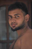 topless man with black beard