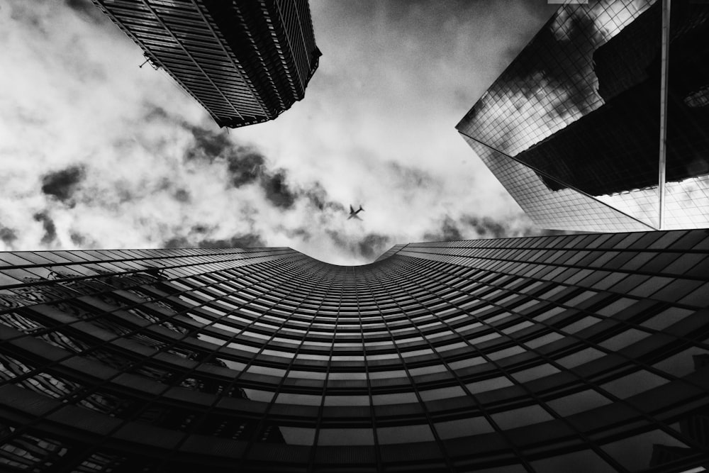 worms eye view of building under cloudy sky