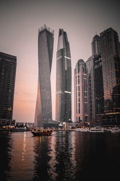 high rise building near body of water during night time