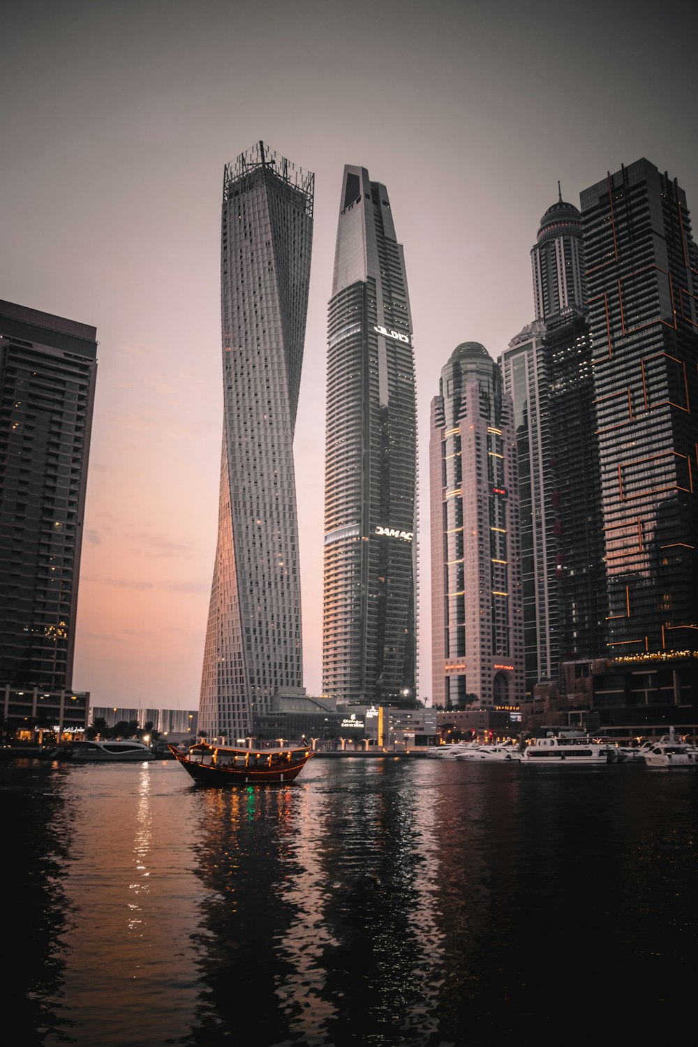 high rise building near body of water during night time