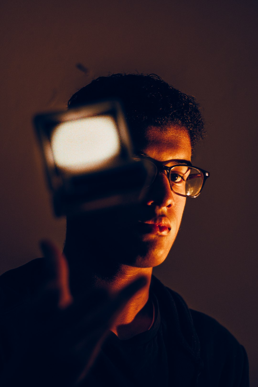 man in black framed eyeglasses