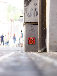 A candid shot of young Albanians engaging in a street art project reflecting contemporary culture.