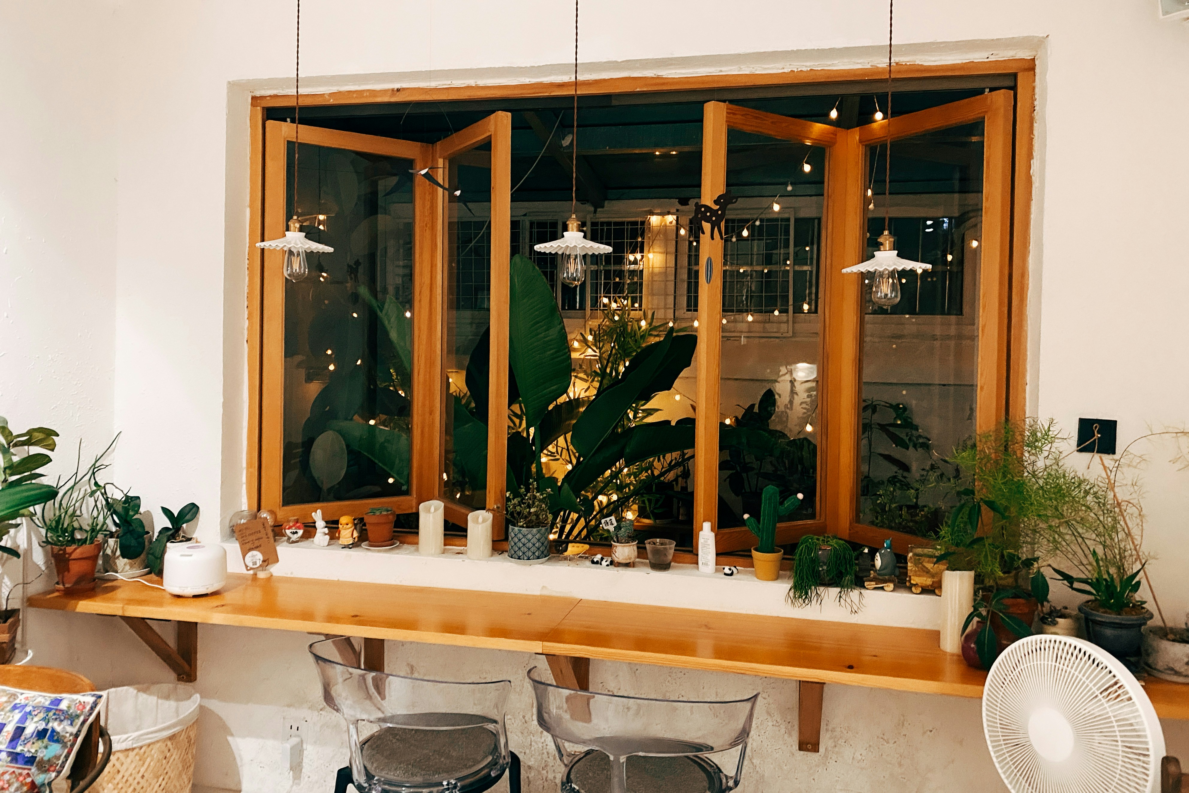green potted plant on white ceramic sink