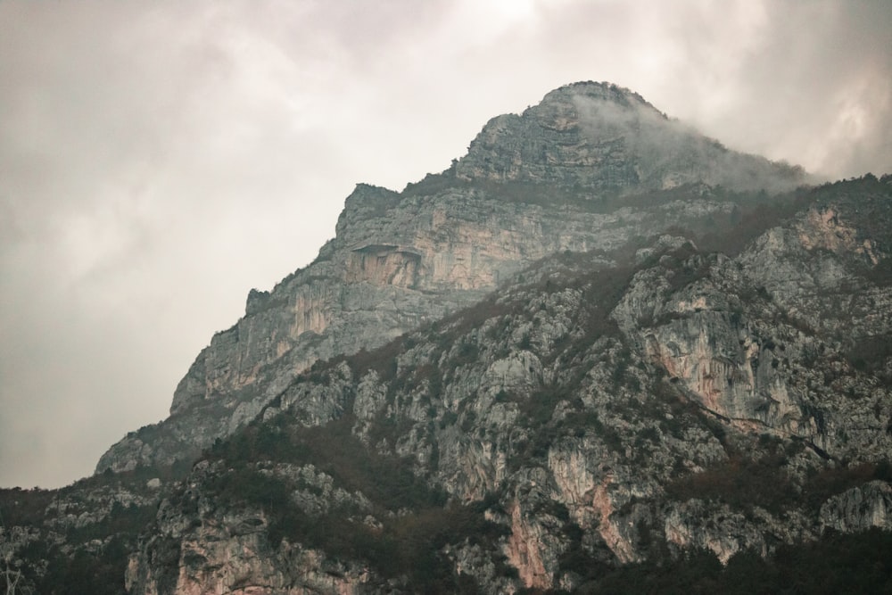 brown and green mountain under white sky during daytime