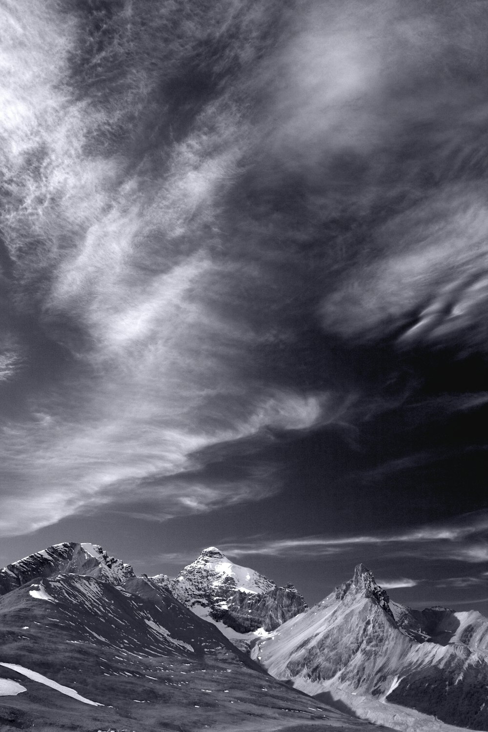 a black and white photo of a mountain range