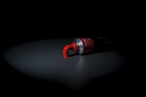 red and black plastic tool