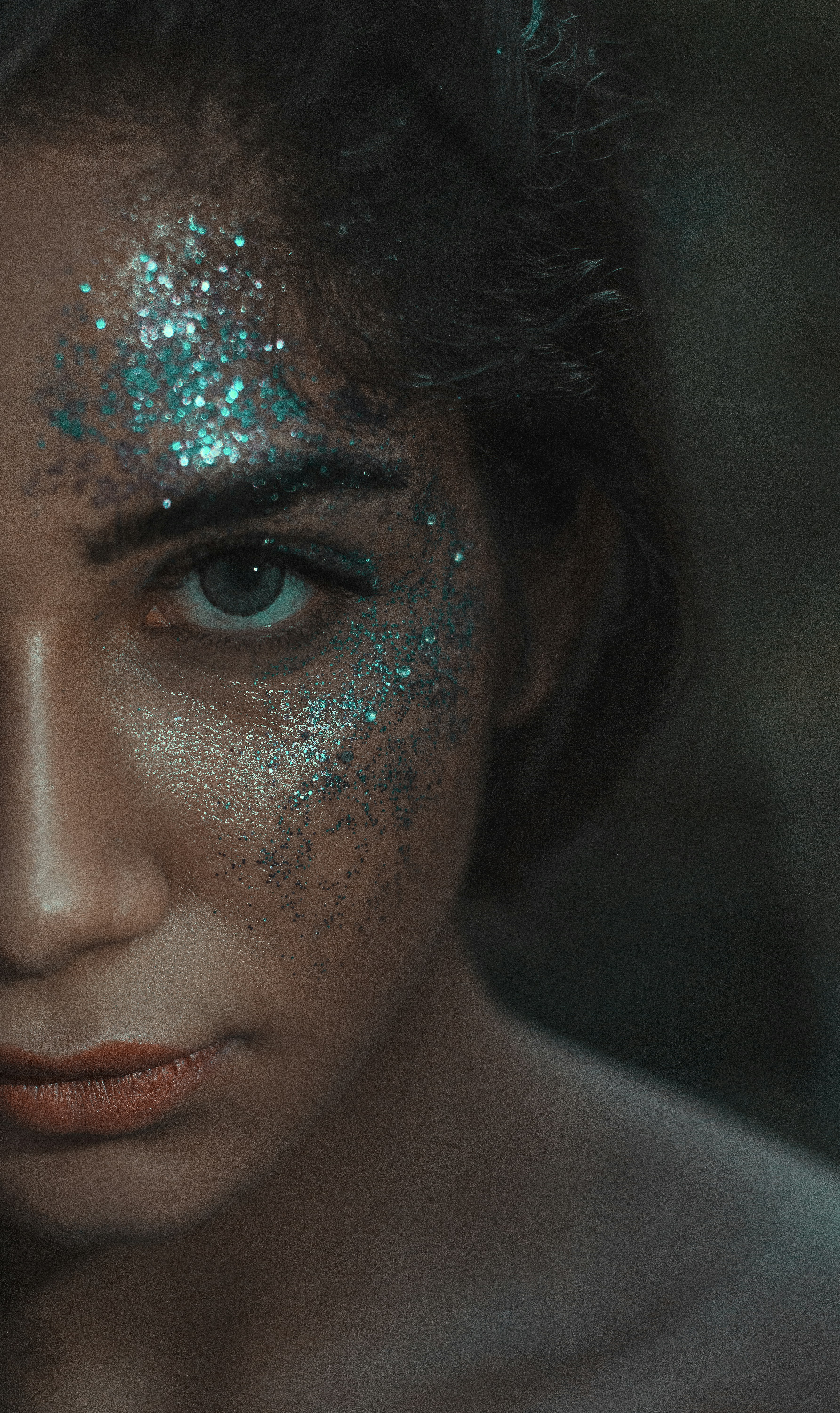woman with blue and green face paint