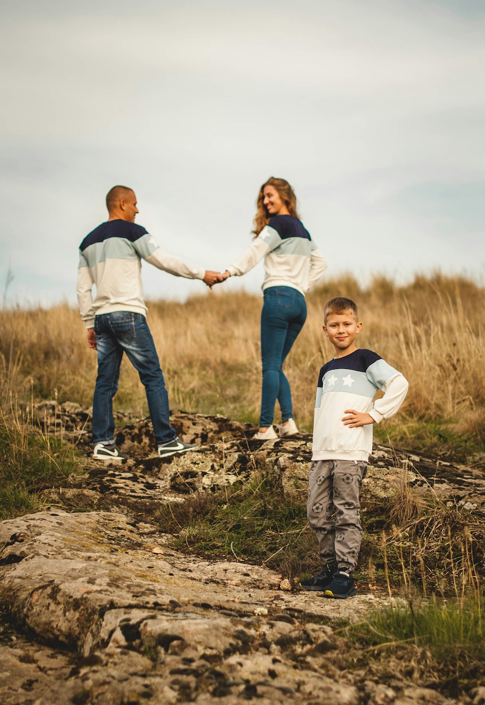 man in white long sleeve shirt carrying girl in white long sleeve shirt