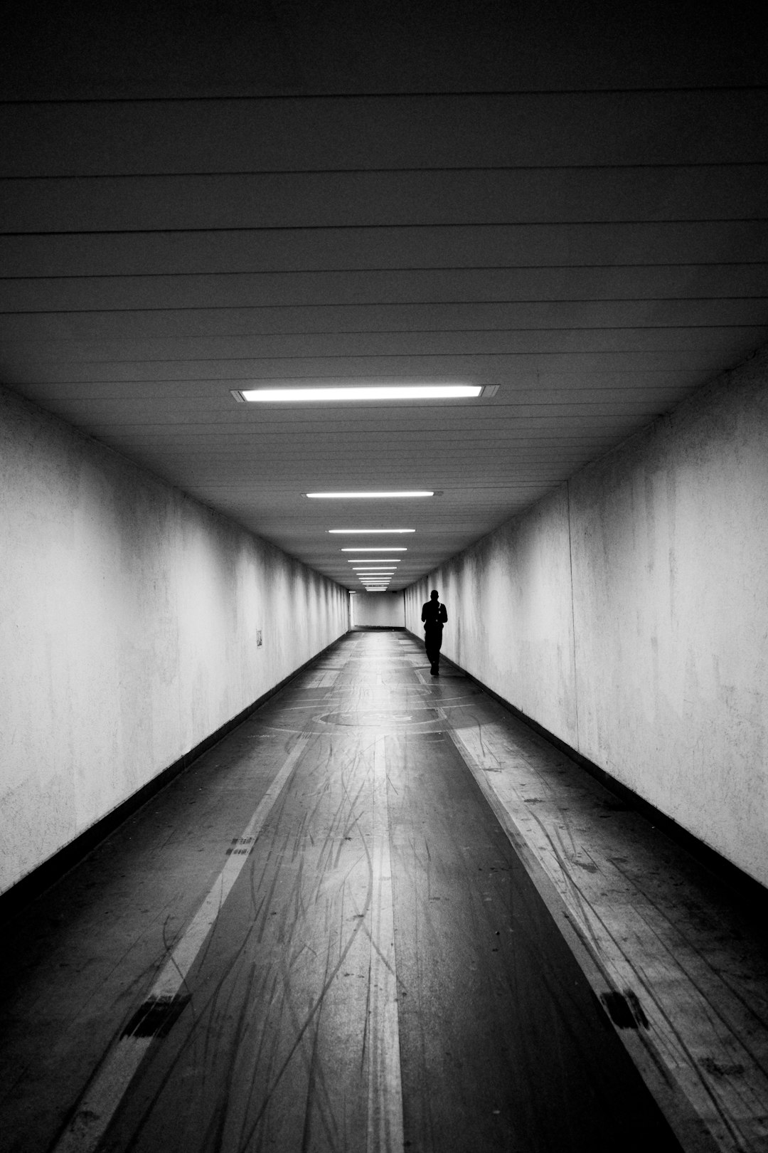 grayscale photo of a hallway