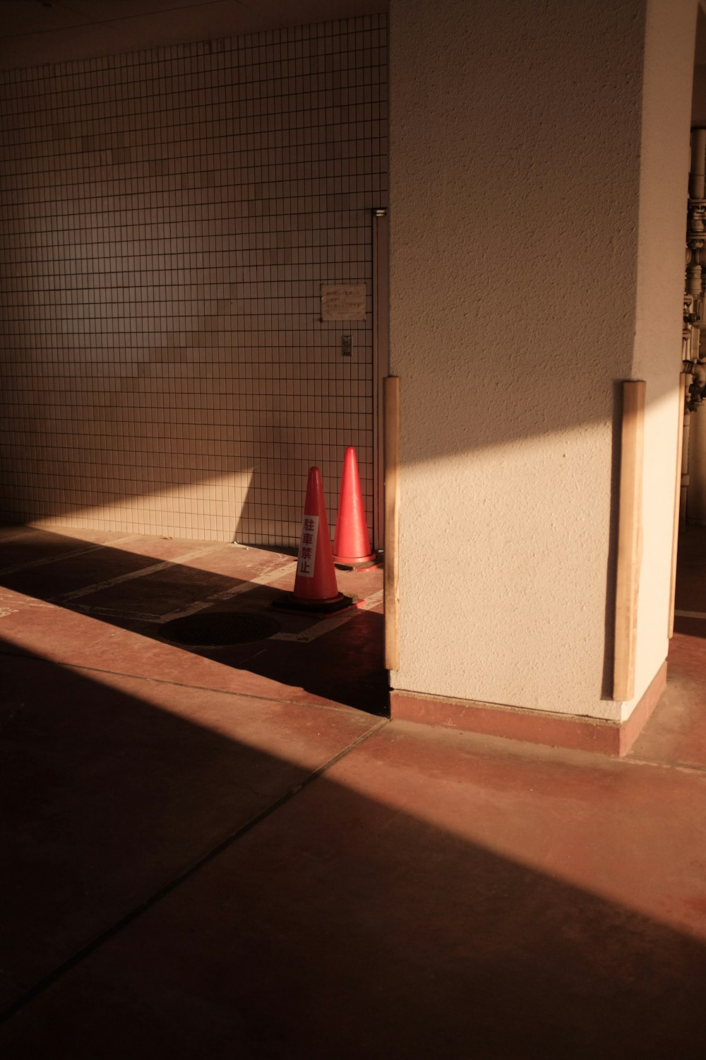 red umbrella on brown concrete floor