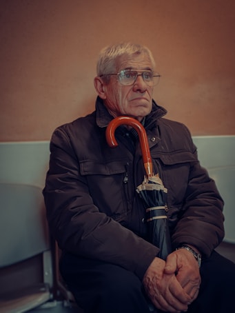man in black jacket wearing eyeglasses