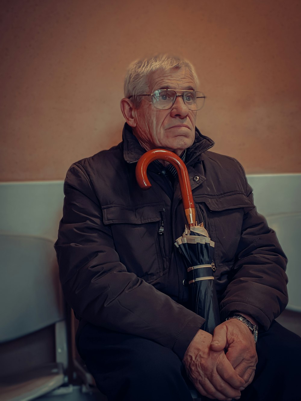 man in black jacket wearing eyeglasses