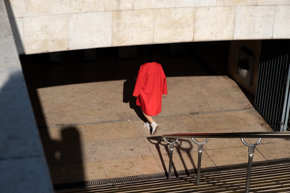 red long sleeve dress on gray steel railings