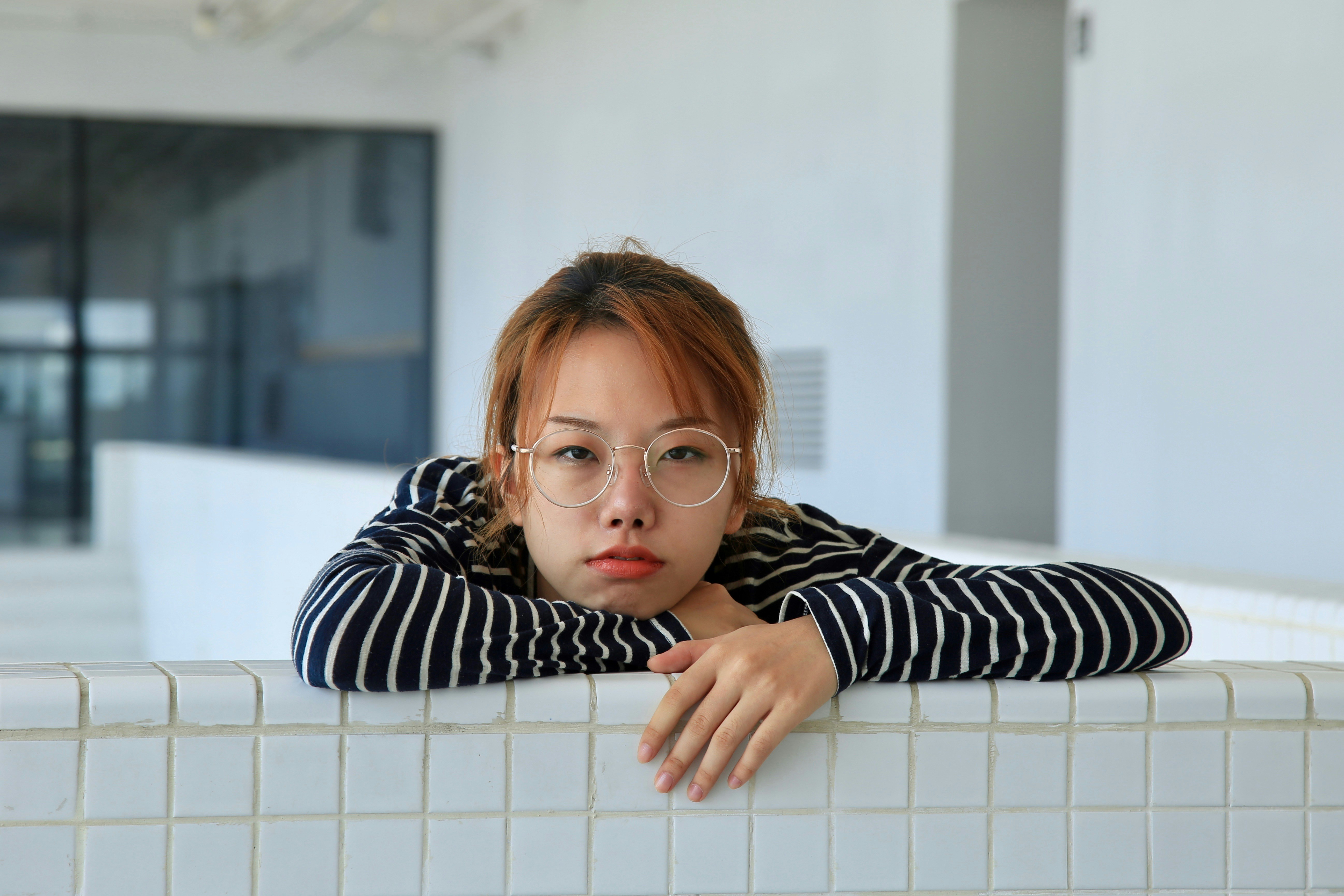 girl-in-black-and-white-striped-long-sleeve-shirt-wearing-eyeglasses