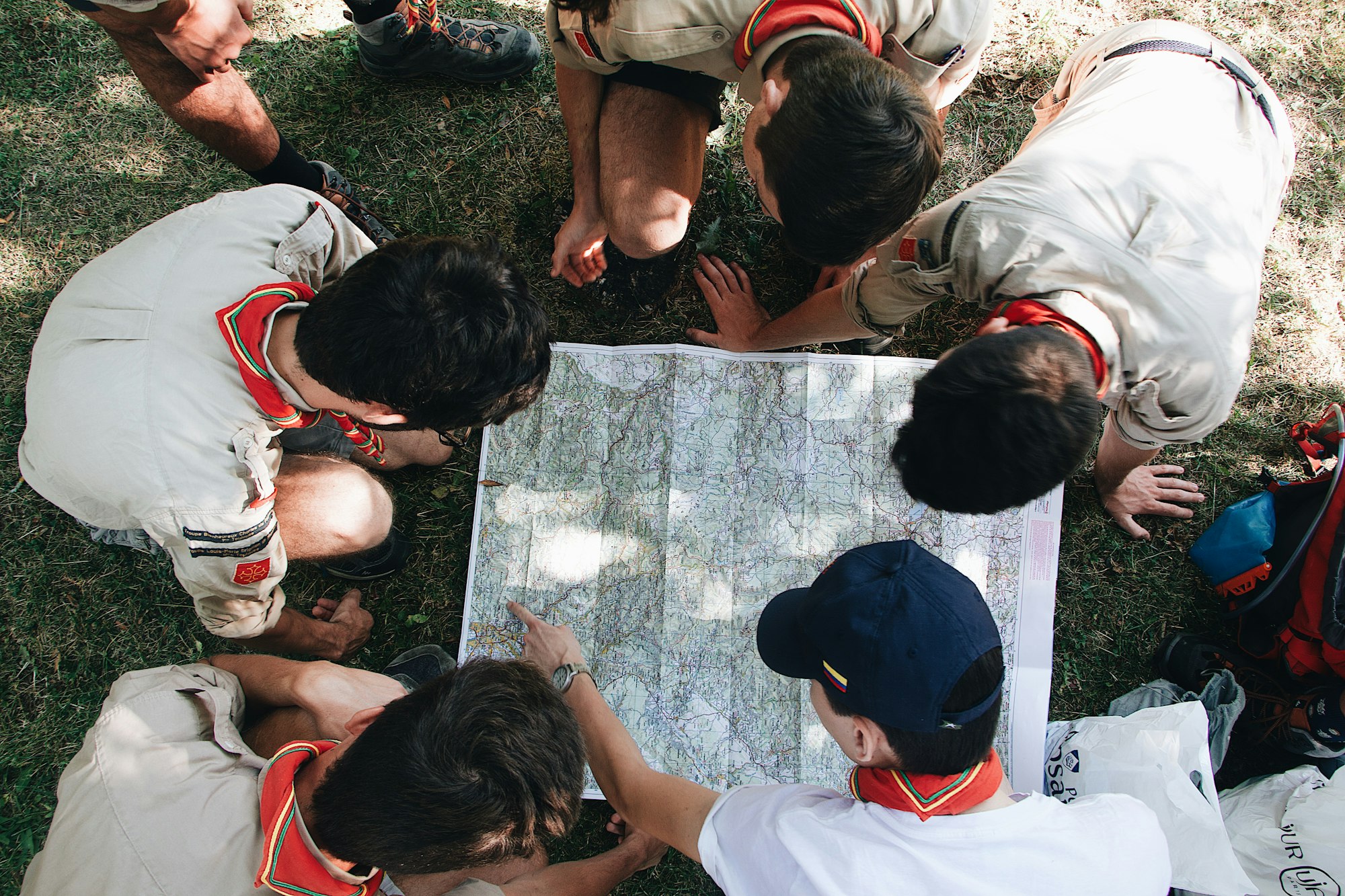 children exploring a map going in a adventure