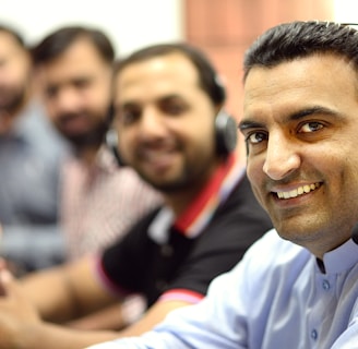 man in white button up shirt smiling