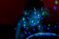 A colorful spread showing a child flying through a magical sky filled with stars and friendly creatures.