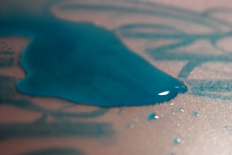 A hand wiping a spill off a waterproof folder, showing its easy-to-clean surface.