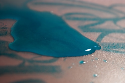 A hand wiping a spill off a waterproof folder, showing its easy-to-clean surface.