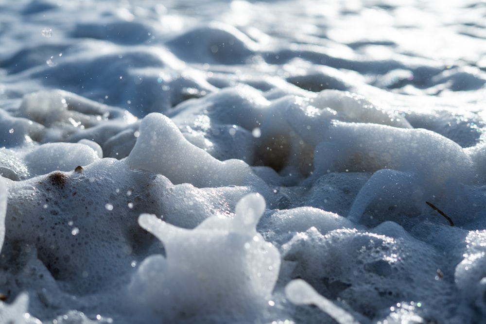 white ice on blue water